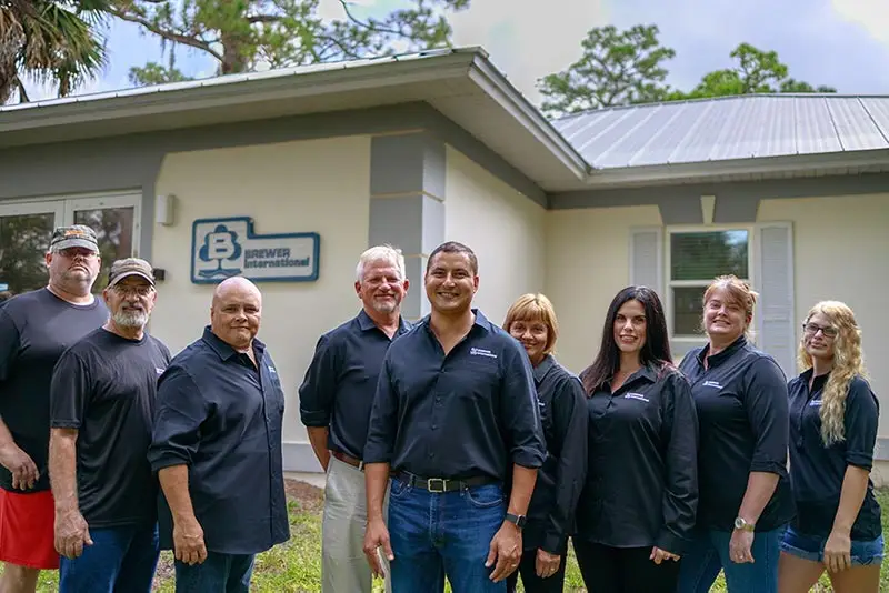 Brewer International team in front of their facility in Vero Beach, FL